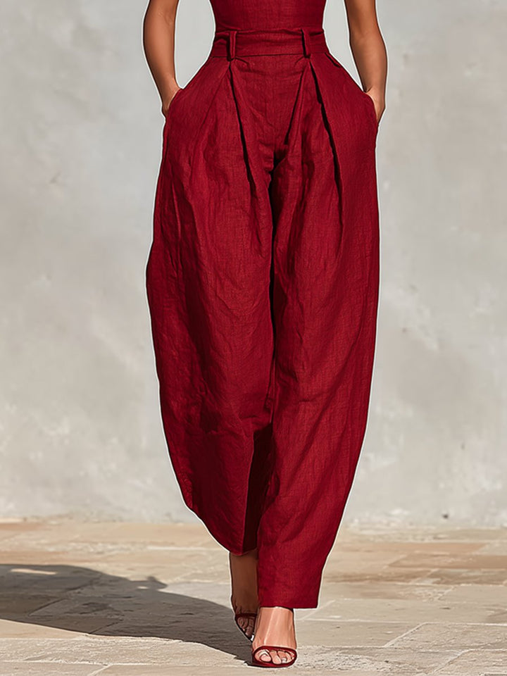 Chic black women's spaghetti strap wide-leg jumpsuit, high-waist design. Great for formal parties & events.