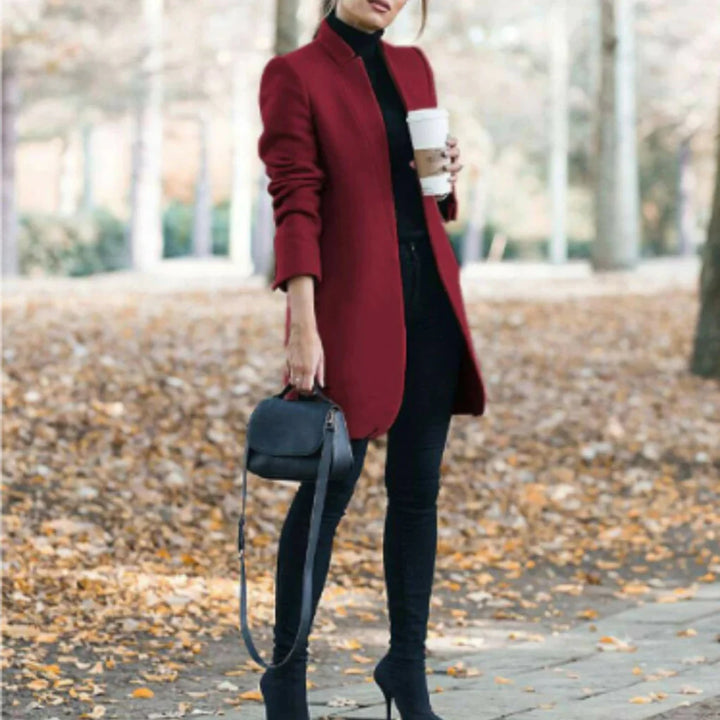 Structured women's stand-collar winter coat. Elegant, warm outerwear with a stylish button front for fall/winter fashion.
