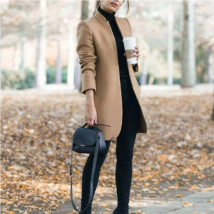 Warm women's stand-collar winter coat. Elegant long outerwear with a structured design & button front for cold weather style.
