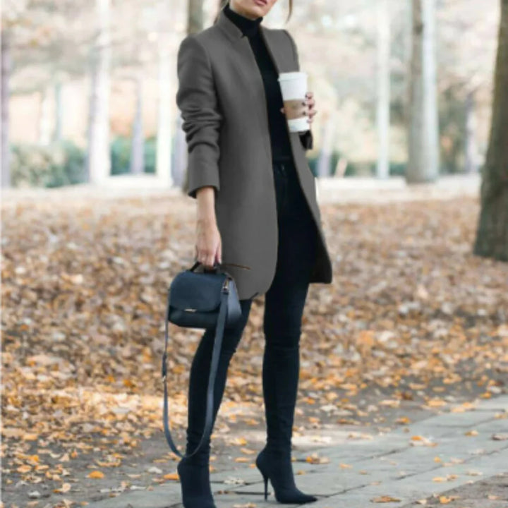 Elegant women's long stand-collar winter coat. Chic, warm fall/winter outerwear with a structured silhouette & button front.