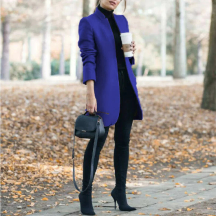 Chic women's stand-collar winter coat offering elegant warmth. Structured long outerwear with button front for fashion.