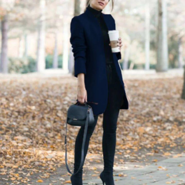 Women's elegant stand-collar winter coat for cold weather. Fashionable, warm, structured outerwear with button front detail.
