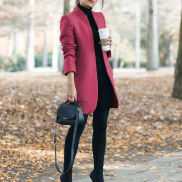 Sophisticated women's stand-collar winter coat. Elegant, warm long outerwear with structured button front for cold days.