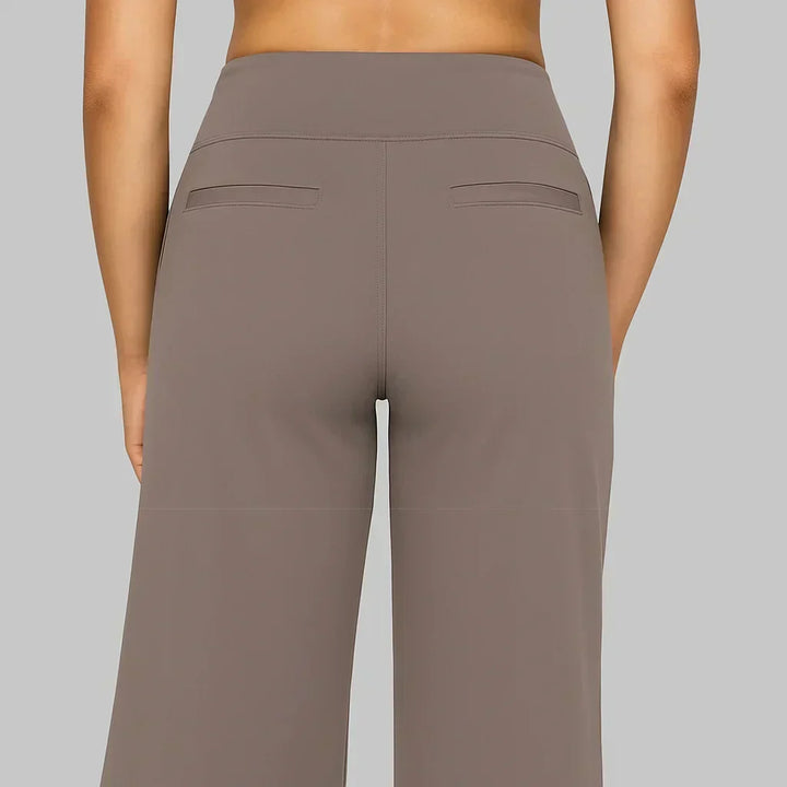 Elegant women's straight fit pants, black, soft fabric, perfect for a chic summer outfit.
