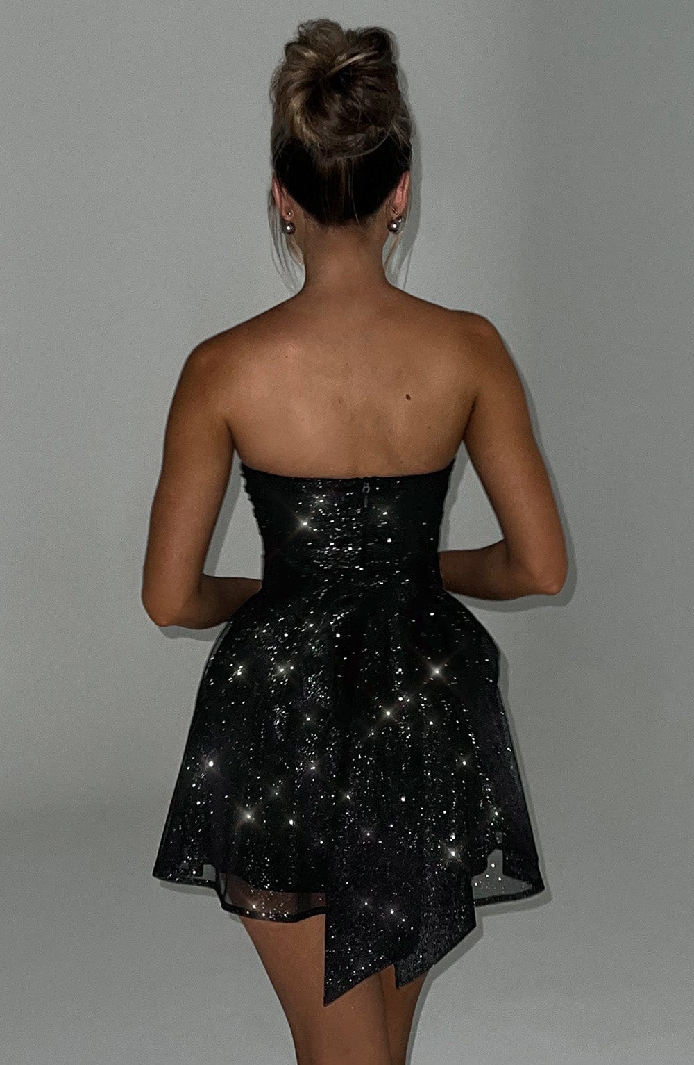 Chic strapless A-line mini dress, a glittery women's choice for cocktails & evening.