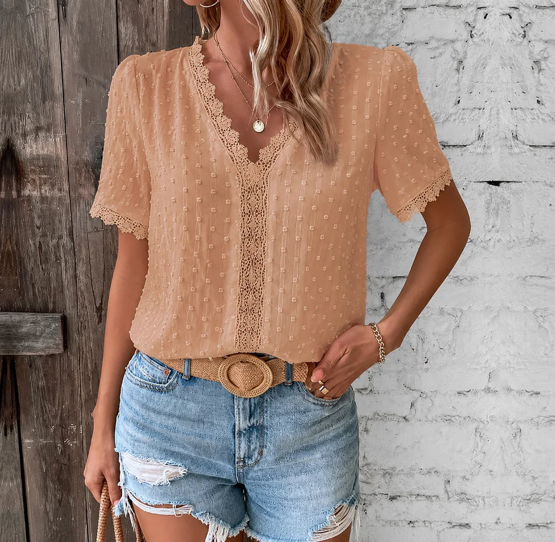 Women's elegant Swiss dot V-neck blouse with delicate lace panels, short sleeves, perfect for summer.
