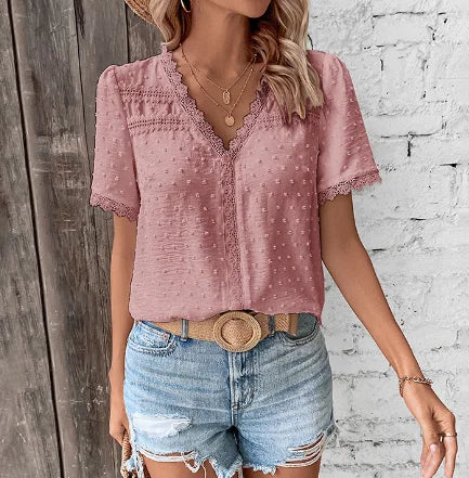 Casual women's Swiss dot blouse with a flattering V-neckline & delicate lace panels, ideal for warm weather.