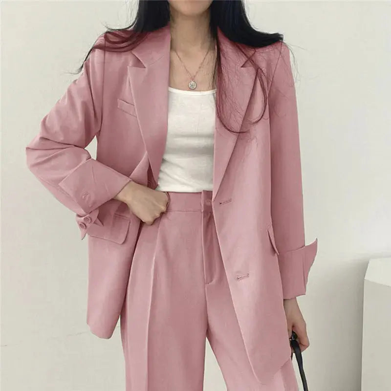 Women's elegant tailored blazer & trouser set for professional office wear.