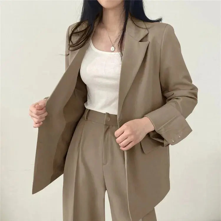 Women's tailored blazer & trouser set, a refined choice for professional elegance.