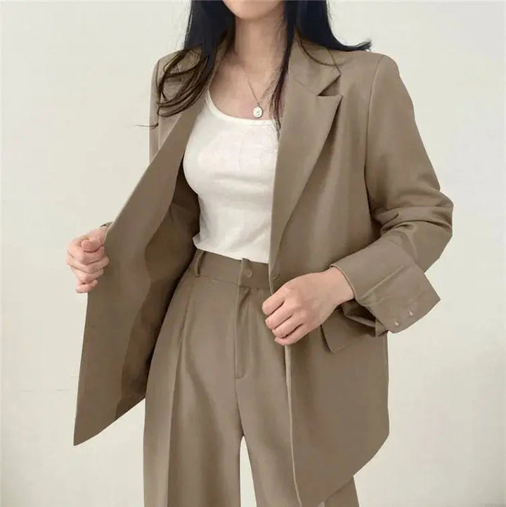 Women's tailored blazer & trouser set, a refined choice for professional elegance.