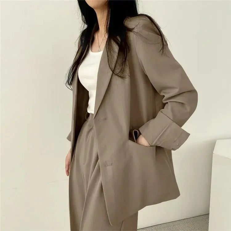 Elegant women's office wear: a chic blazer and pant set for modern professionals.