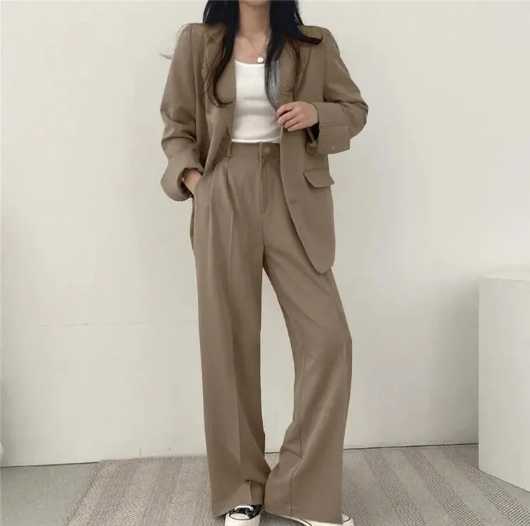 Business women's two-piece suit, with a tailored blazer for a sophisticated look.