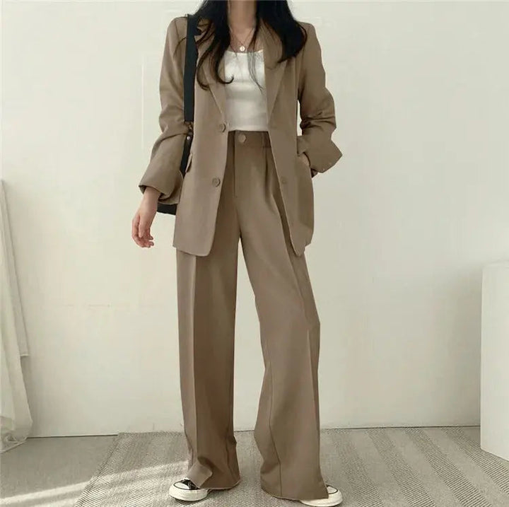Versatile women's professional outfit, a modern tailored blazer and trouser set.