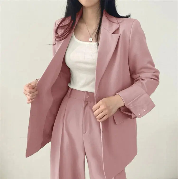Chic two-piece women's suit, ideal for business meetings & formal occasions.