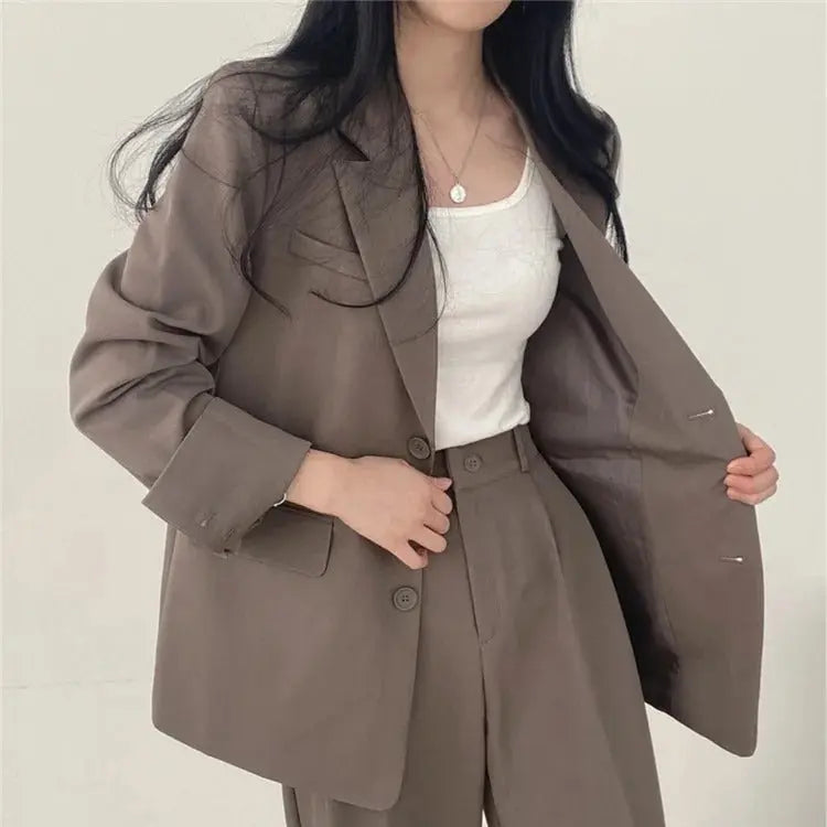 Elegant women's outfit, a two-piece suit ideal for professional settings.