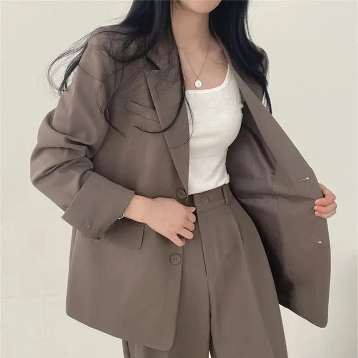 Elegant women's outfit, a two-piece suit ideal for professional settings.