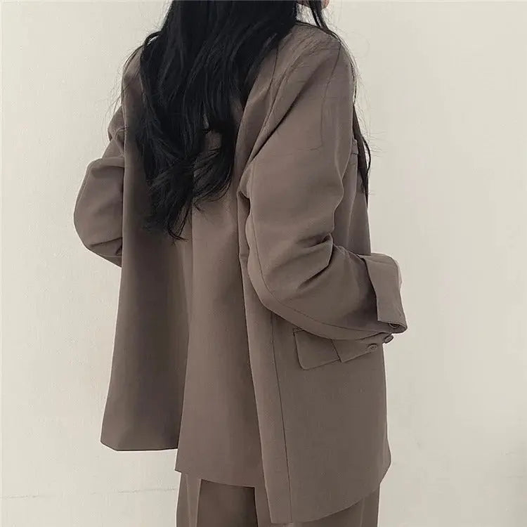 Chic women's tailored suit, versatile for office, formal, or smart casual wear.