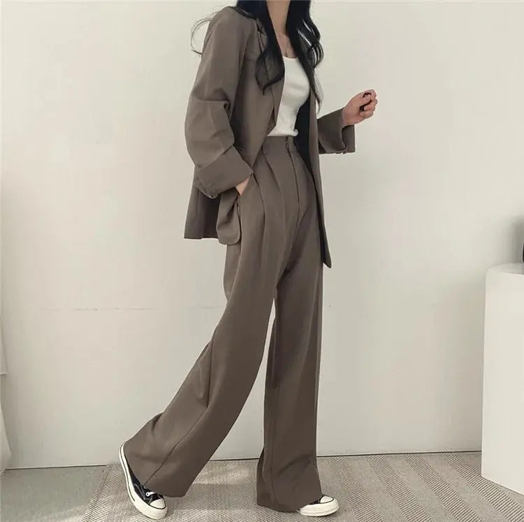 Sophisticated women's two-piece set, a blazer & trousers for elegant workwear.