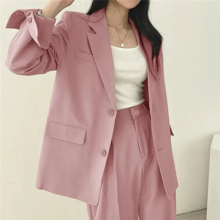 Modern tailored blazer and relaxed fit trousers, a versatile smart casual women's outfit.