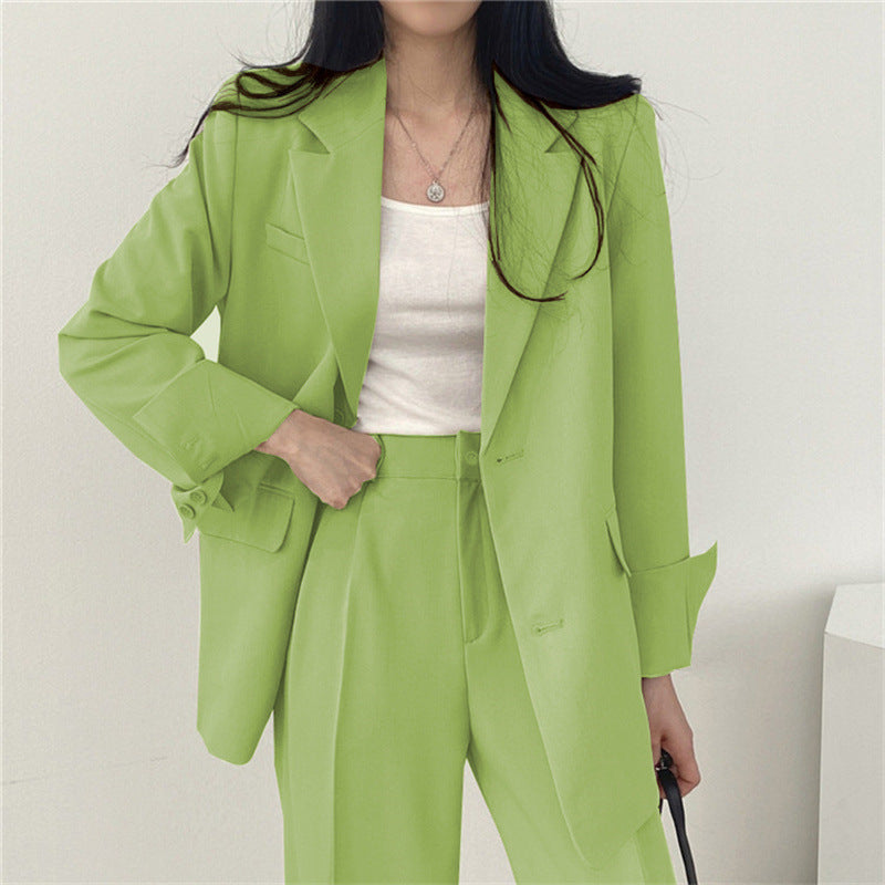 Professional women's tailored blazer & trouser set, ideal for chic business attire.