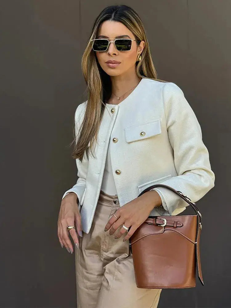 Women's elegant textured cropped jacket with button-up front. Chic fall/spring outerwear.