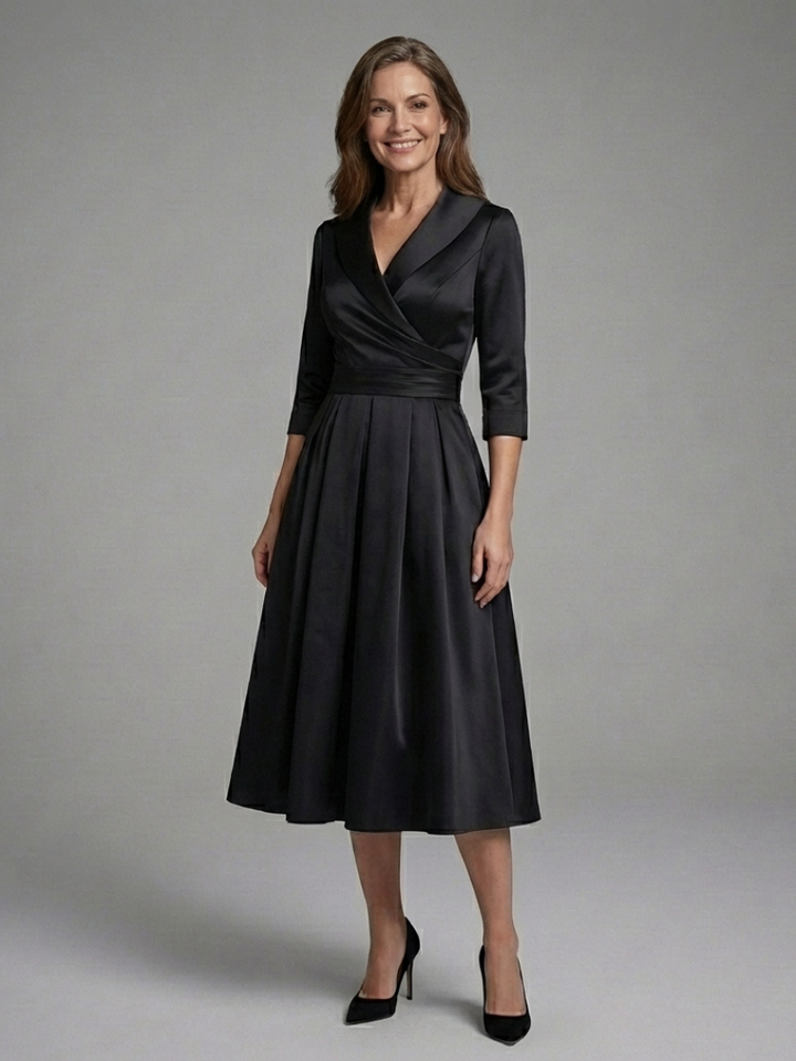 Women's elegant three-quarter sleeve wrap bodice midi dress with a flowing flared skirt.