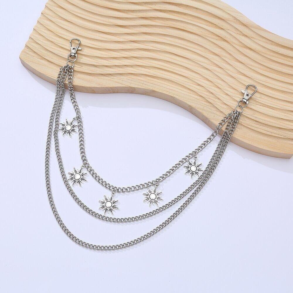 Versatile women's elegant sun motif triple chain necklace, ideal for daily wear or special occasions.