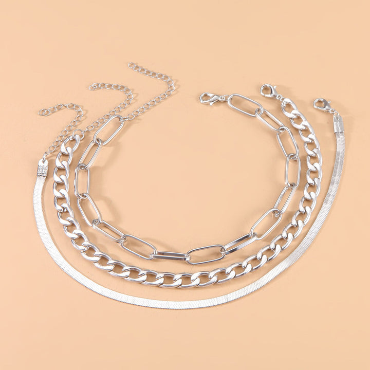 Close-up: Women's twisted chain bracelet, showcasing silver & gold tones, elegant design.