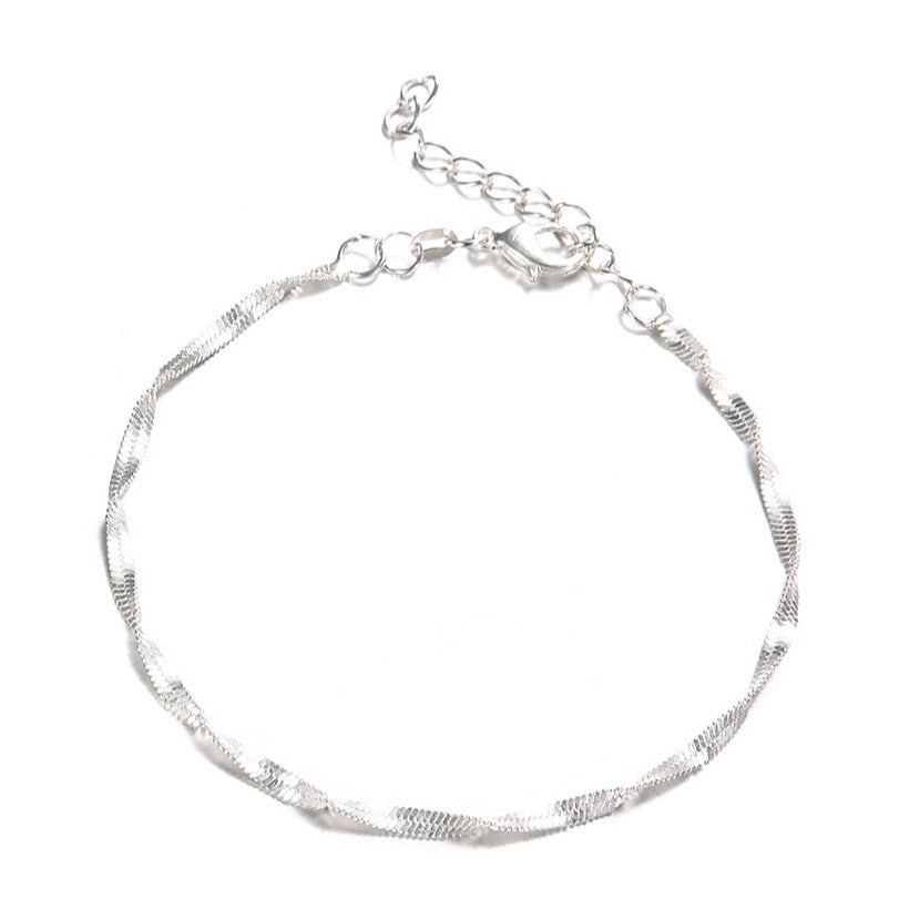 Versatile women's twisted chain bracelet, a silver & gold tone jewelry piece for everyday elegance.