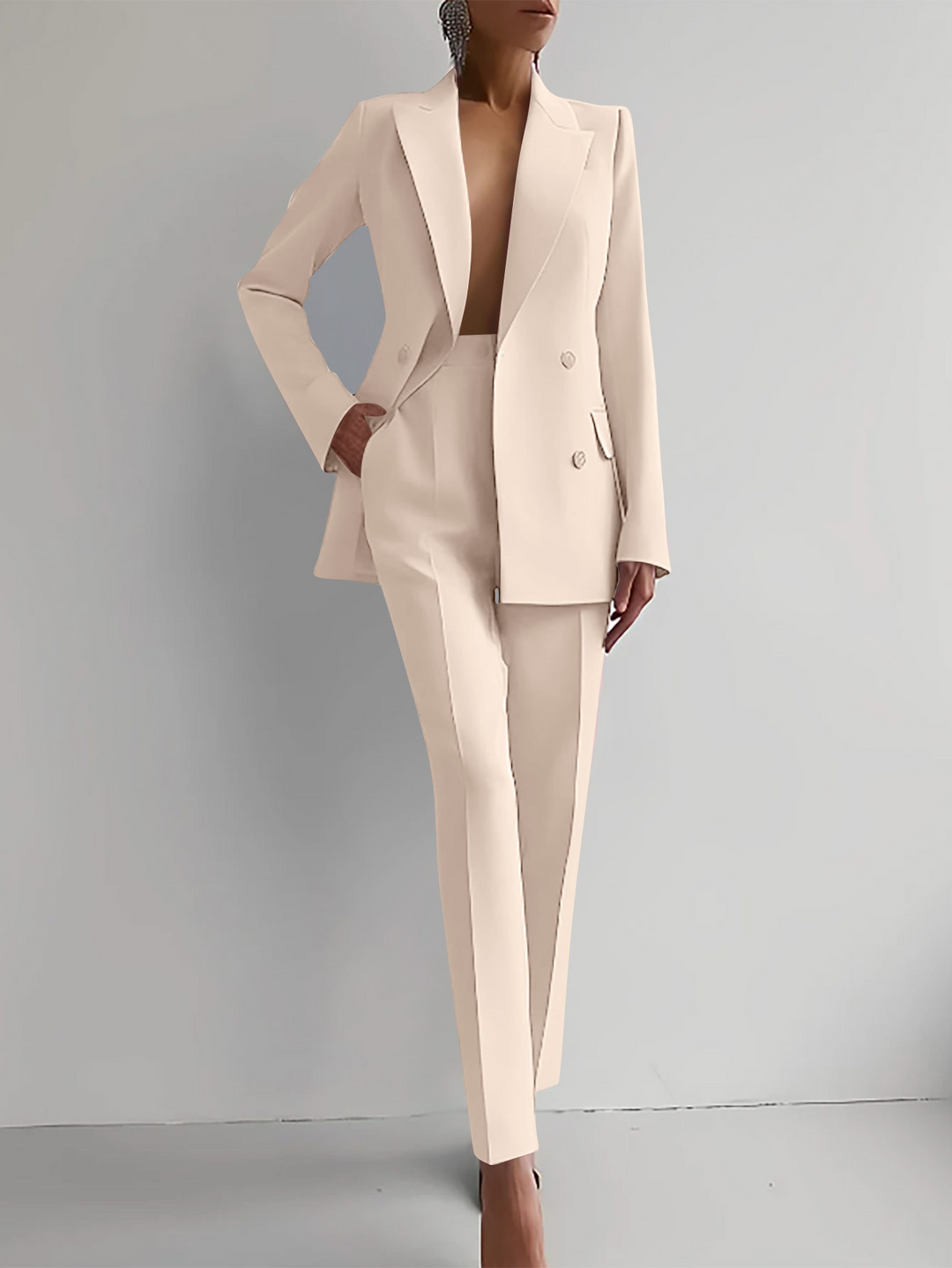 Women's professional two-piece suit: elegant blazer and tailored pants for a sophisticated business look.