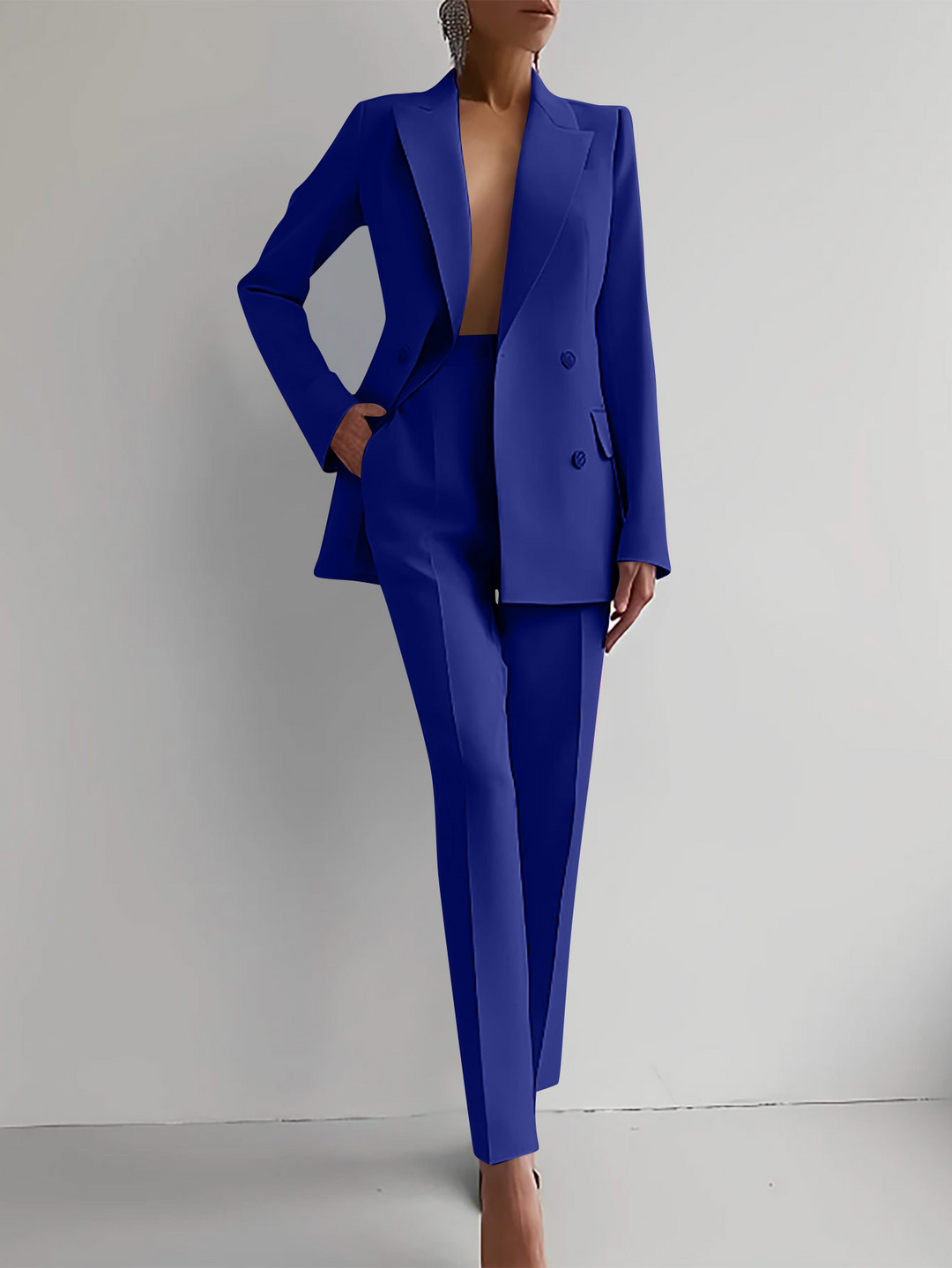 Women's formal two-piece blazer and pants set, a refined and professional office fashion outfit.