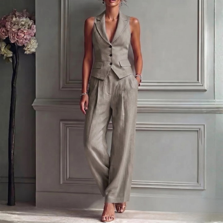 Stylish women's two-piece outfit featuring a sleeveless tailored vest & flowing high-waist wide-leg pants.