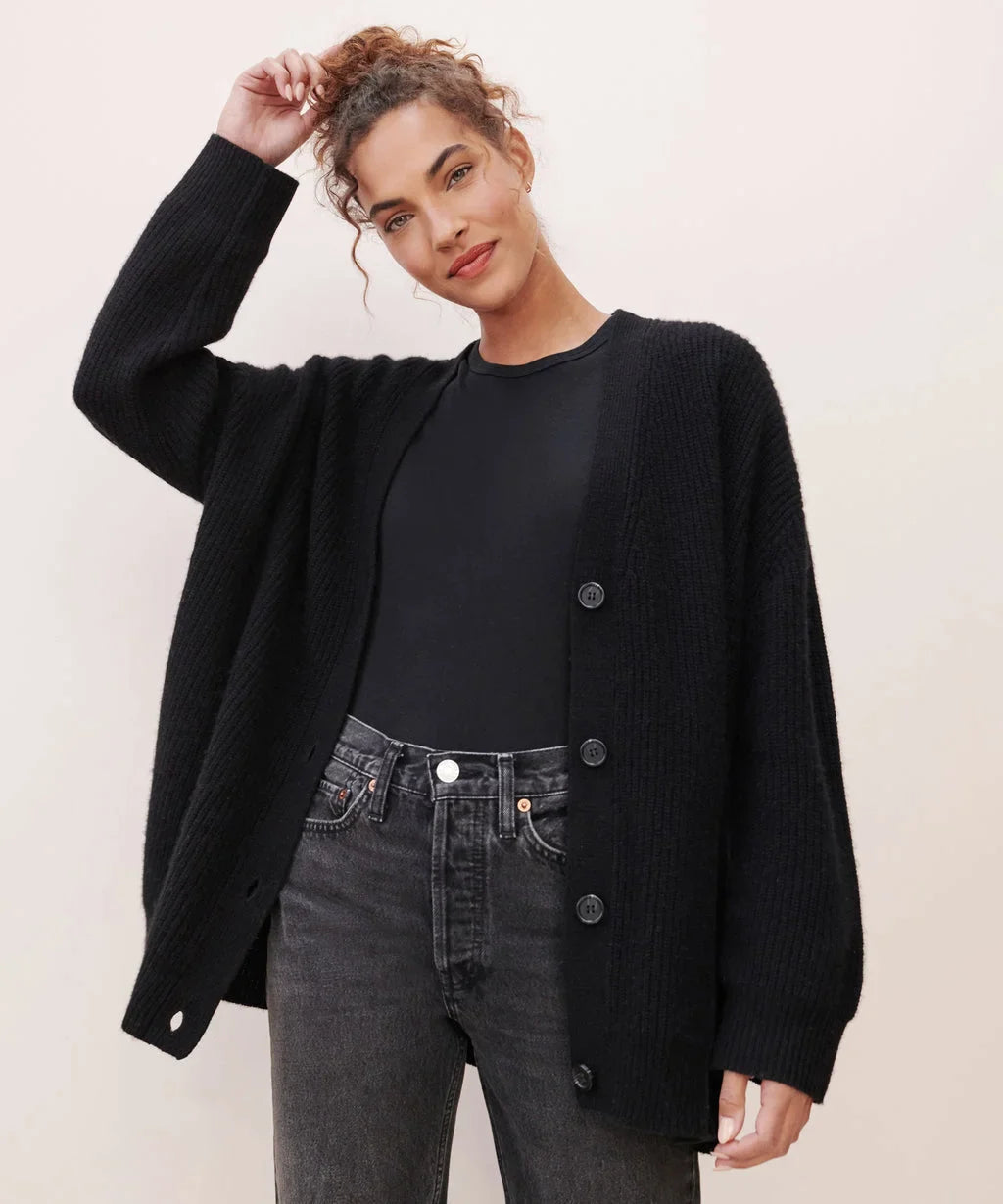Stylish women's long sleeve V-neck cardigan, an elegant knit top for versatile looks.