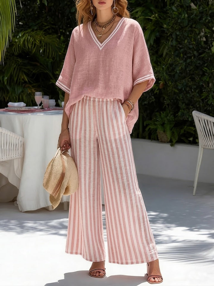 Stylish women's two-piece V-neck top and striped pants set. Comfortable casual wear for travel or everyday.