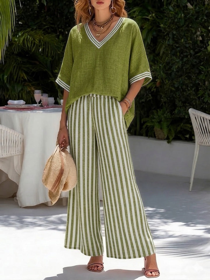 Effortless elegance: Women's V-neck top & stripe pants set. Stylish, comfortable two-piece for spring/summer.