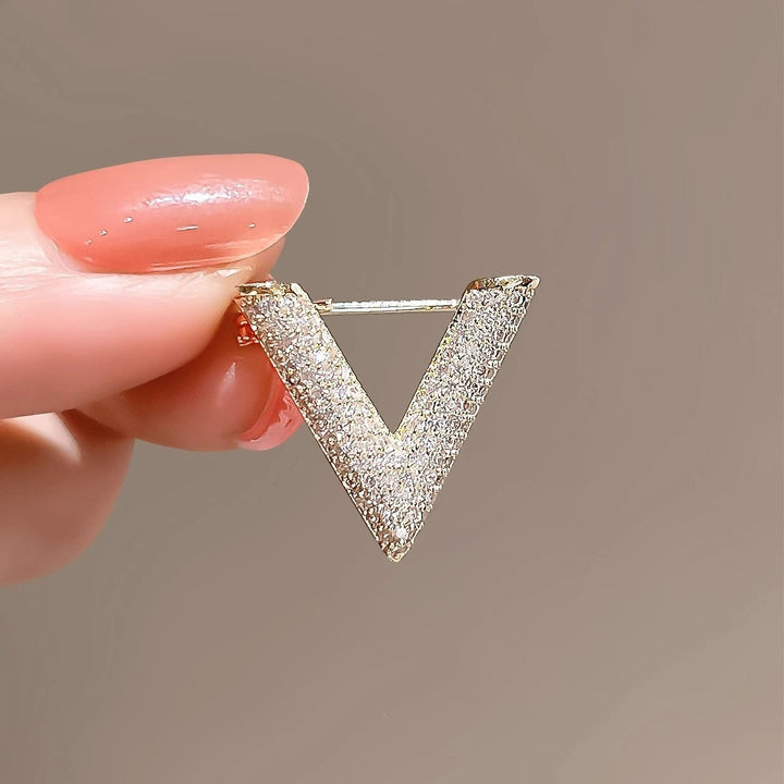 Delicate women's V-shaped crystal brooch, an elegant jewelry accent for any outfit.