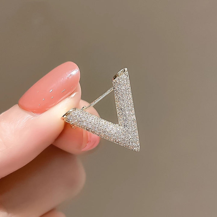 Chic V-shaped crystal brooch for women, a sparkling gold or silver tone fashion accessory.