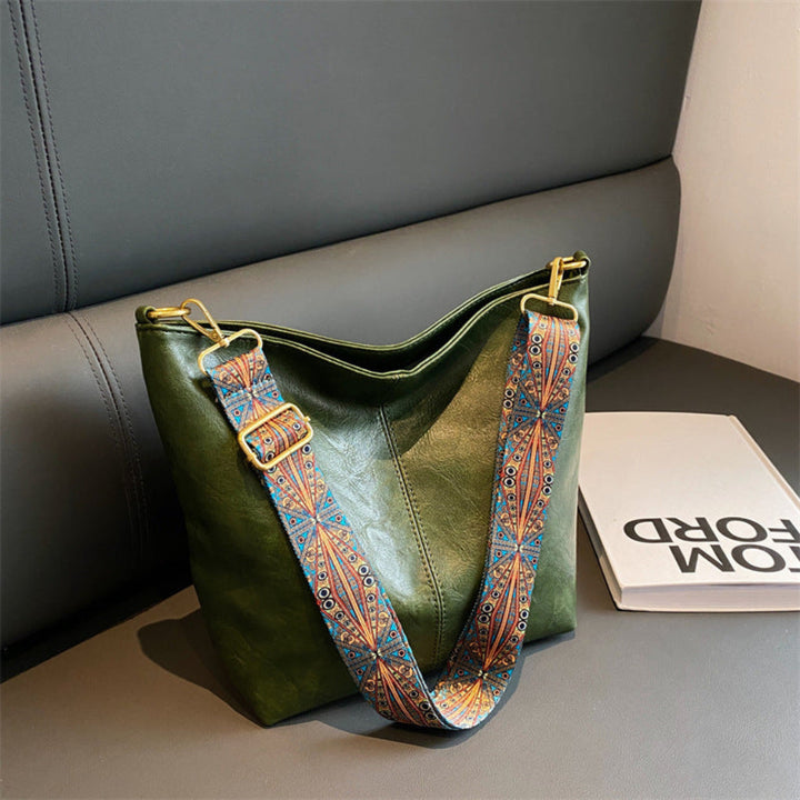 Stylish women's suede leather shoulder bag, versatile for everyday use or as a classic crossbody.