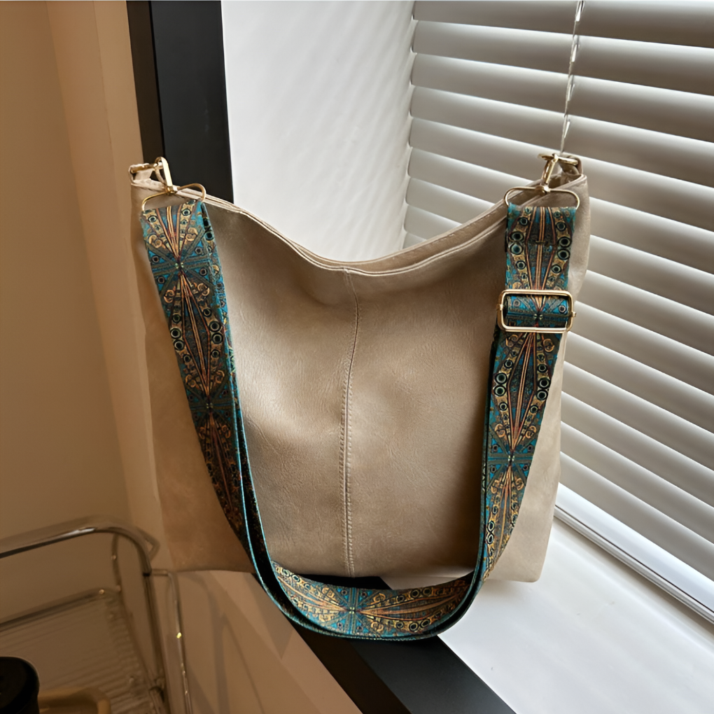 Versatile women's vintage shoulder bag, a stylish suede leather accessory suitable for everyday elegance.