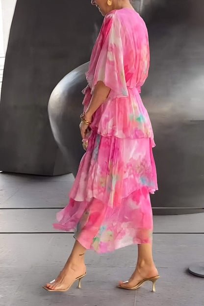 Elegant women's tiered maxi dress, watercolour floral print, V-neck, long sleeves, versatile style.