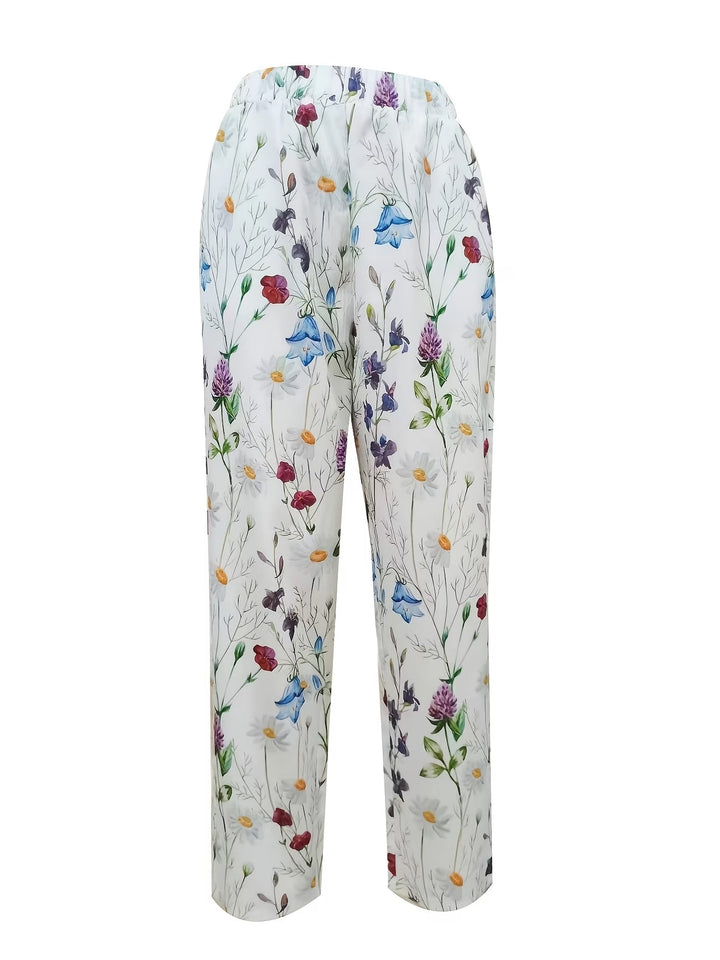White summer trousers for women featuring an elegant floral print. Perfect breathable pants for warm-weather fashion.