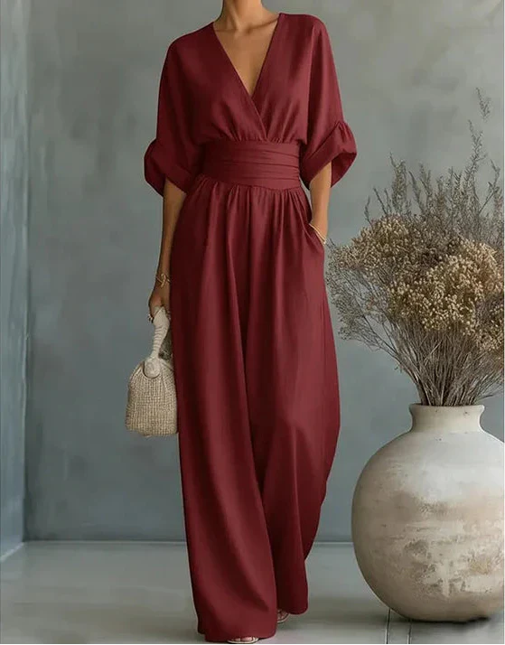 Fashionable women's wide-leg jumpsuit with a graceful flow, great for spring gatherings.