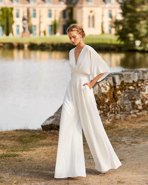 Women's elegant wide leg V-neck jumpsuit for formal evening wear, perfect for special occasions.