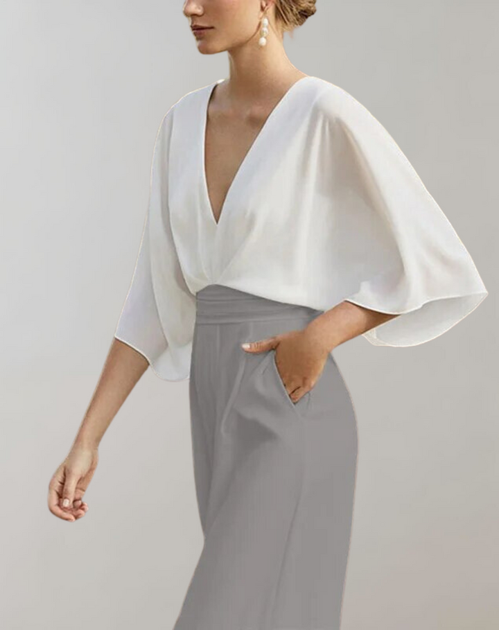 Women's elegant V-neck wide leg jumpsuit with batwing sleeves, ideal formal and party occasion wear.