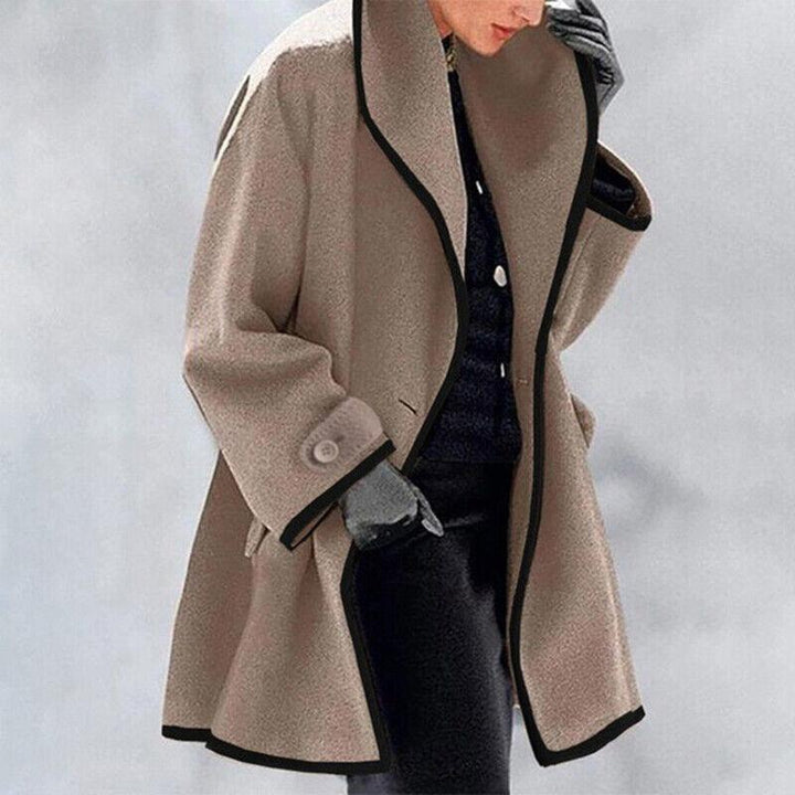 Classic women's winter trench coat featuring a double-button front and elegant silhouette.