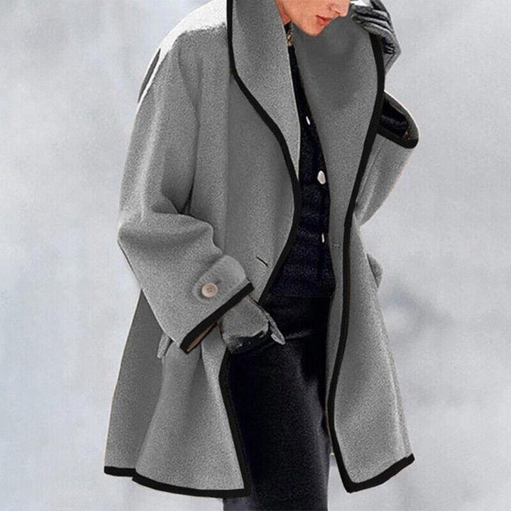 Elegant women's winter double-breasted trench coat, a classic warm fashion statement.