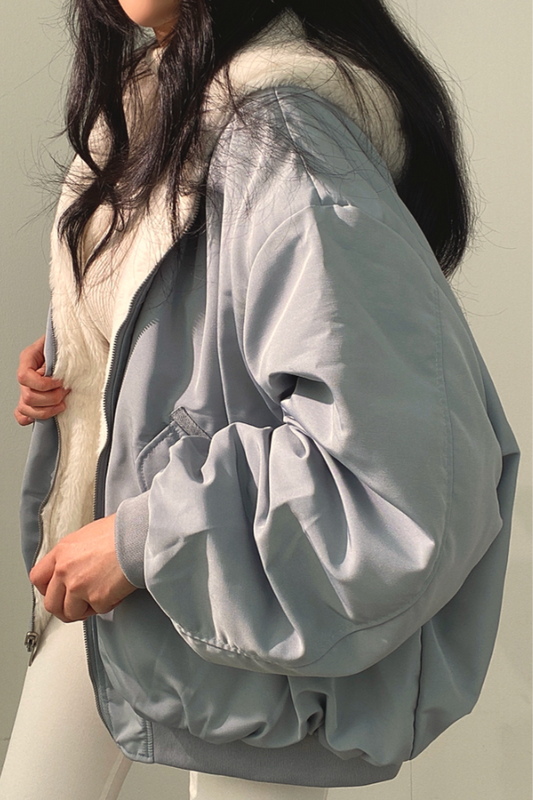 Women's elegant double-button winter trench coat. Classic warm outerwear for stylish women.