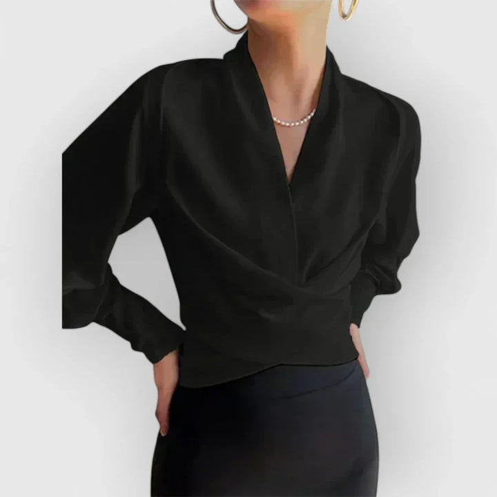Sophisticated women's wrap blouse with long sleeves. Elegant design for office meetings or stylish everyday wear.