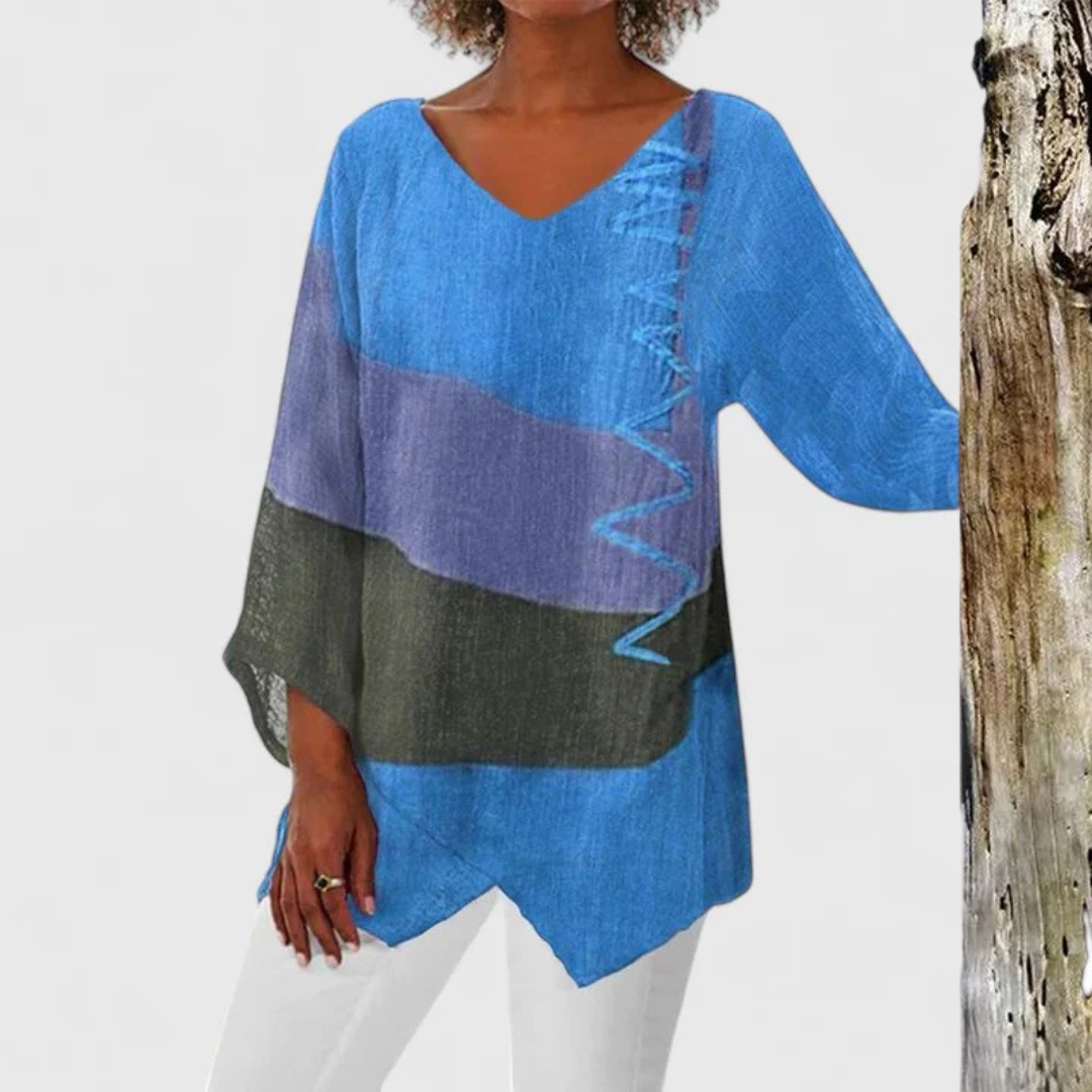 Expressive women's Elysia V-neck tunic with a colorful artistic print, asymmetrical hem, perfect for everyday chic.