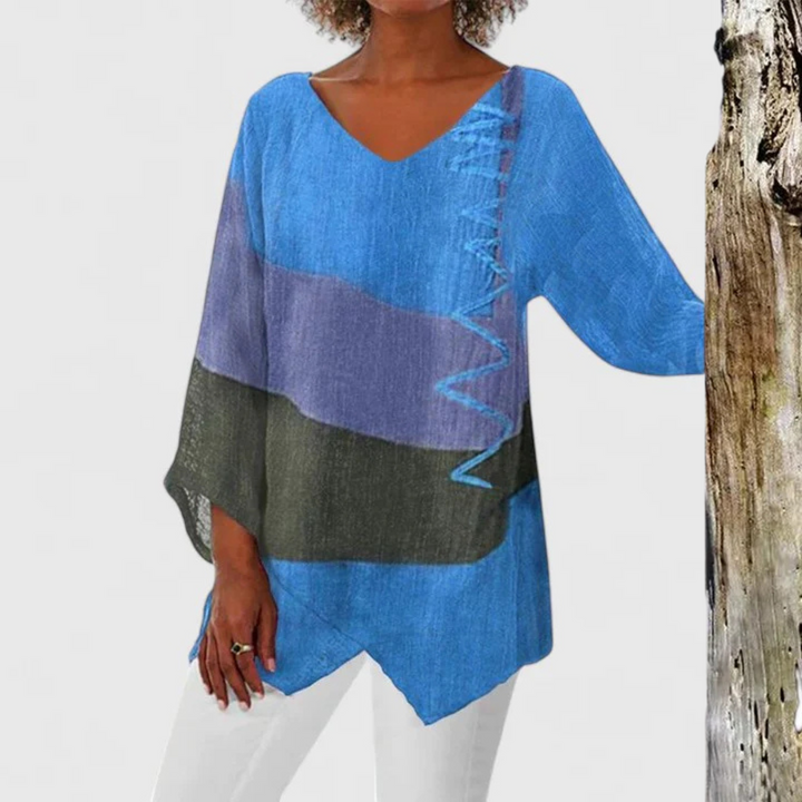 Expressive women's Elysia V-neck tunic with a colorful artistic print, asymmetrical hem, perfect for everyday chic.